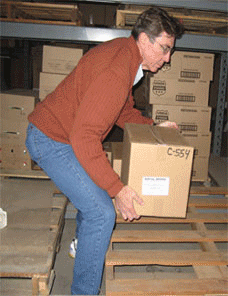 a man loading a handtruck