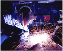 an arc welder working with sparks