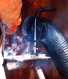 a welding operation with fumes heading towards local ventilation