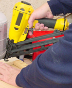 A worker using a pneumatic tool