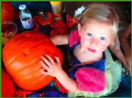 Little girl with pumpkin